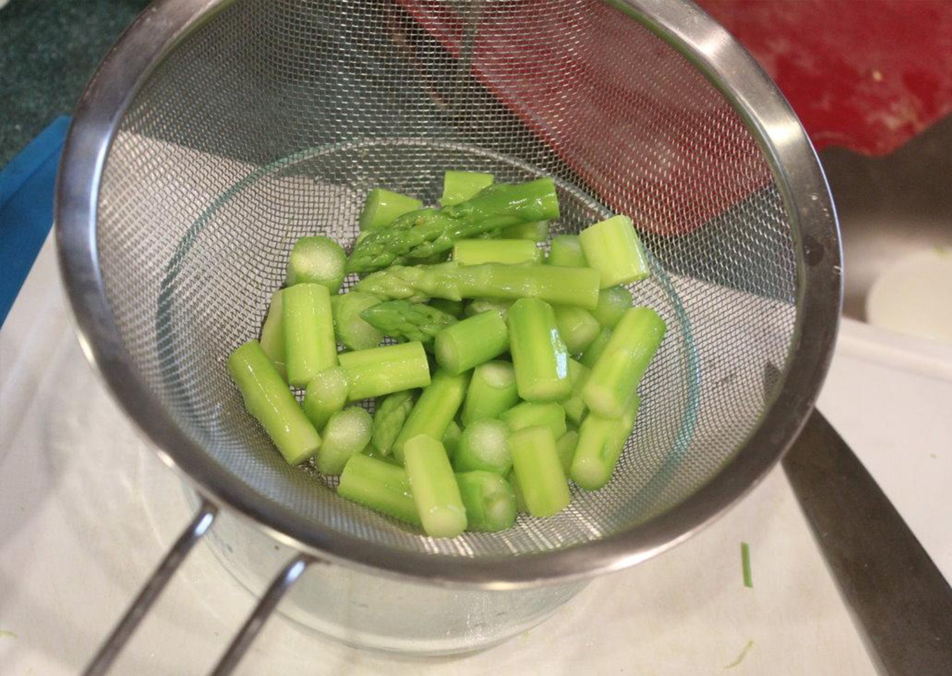 Draining canned asparagus thoroughly before cooking