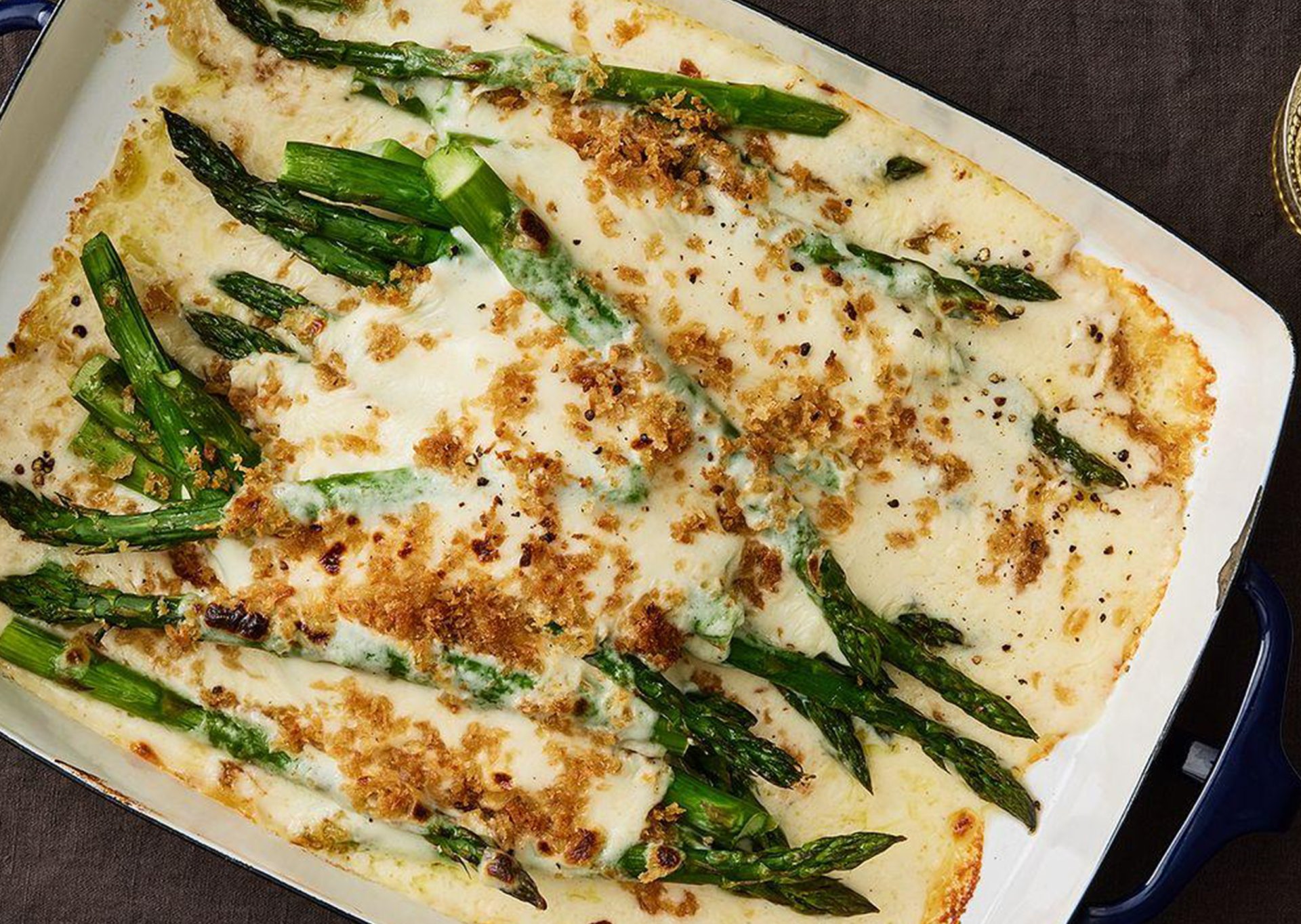 Baked canned asparagus with cheese and breadcrumbs