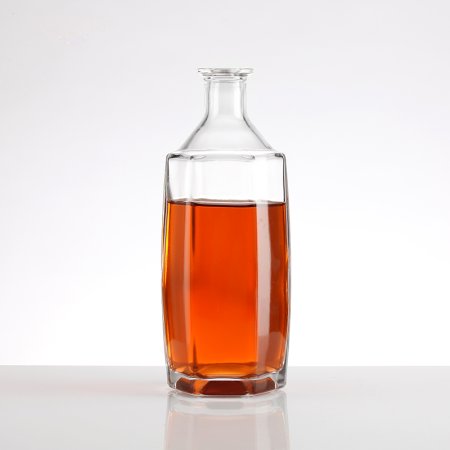 Hexagonal glass bottle with oblique shoulder