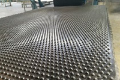 Can Hammer cow mat Be Installed Over Uneven Compacted Gravel?