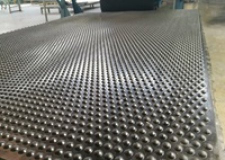 Can Hammer cow mat Be Installed Over Uneven Compacted Gravel?