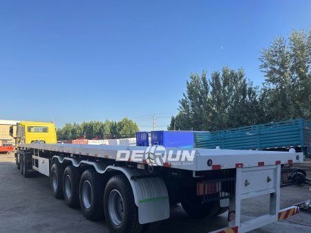 HOWO NX 6x4 Tractor and 4 Axles Flatbed Semi Trailer Finished Product Display