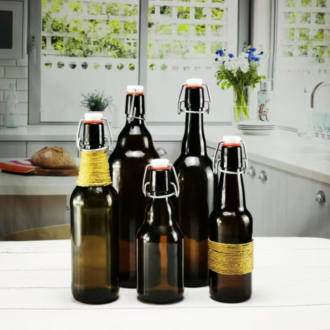 Botella de vidrio ámbar redonda de cuello largo para cerveza