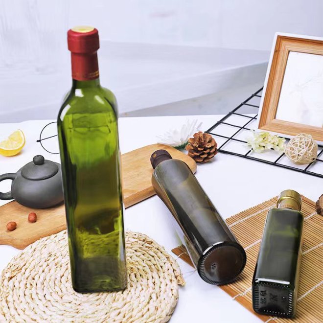 Botella cuadrada de vidrio transparente para aceite de oliva con tapón