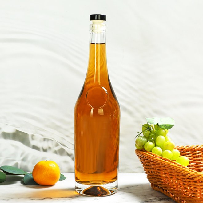 Botella de zumo de vidrio reciclable de marca blanca