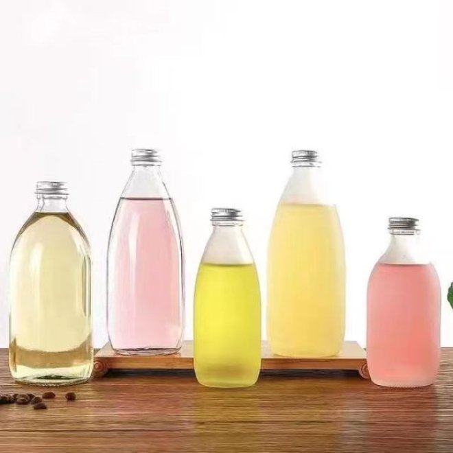 Botella de vidrio reutilizable para zumo de uva con tapa